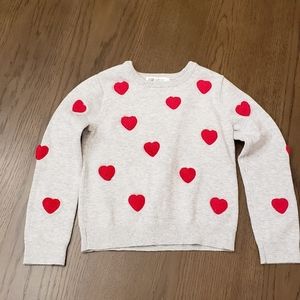 Sweater with heart designs for toddler girls.